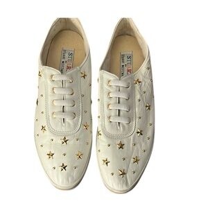 Stuart Weitzman size 10 White Leather slip on Sneakers embellished w/ Gold Stars